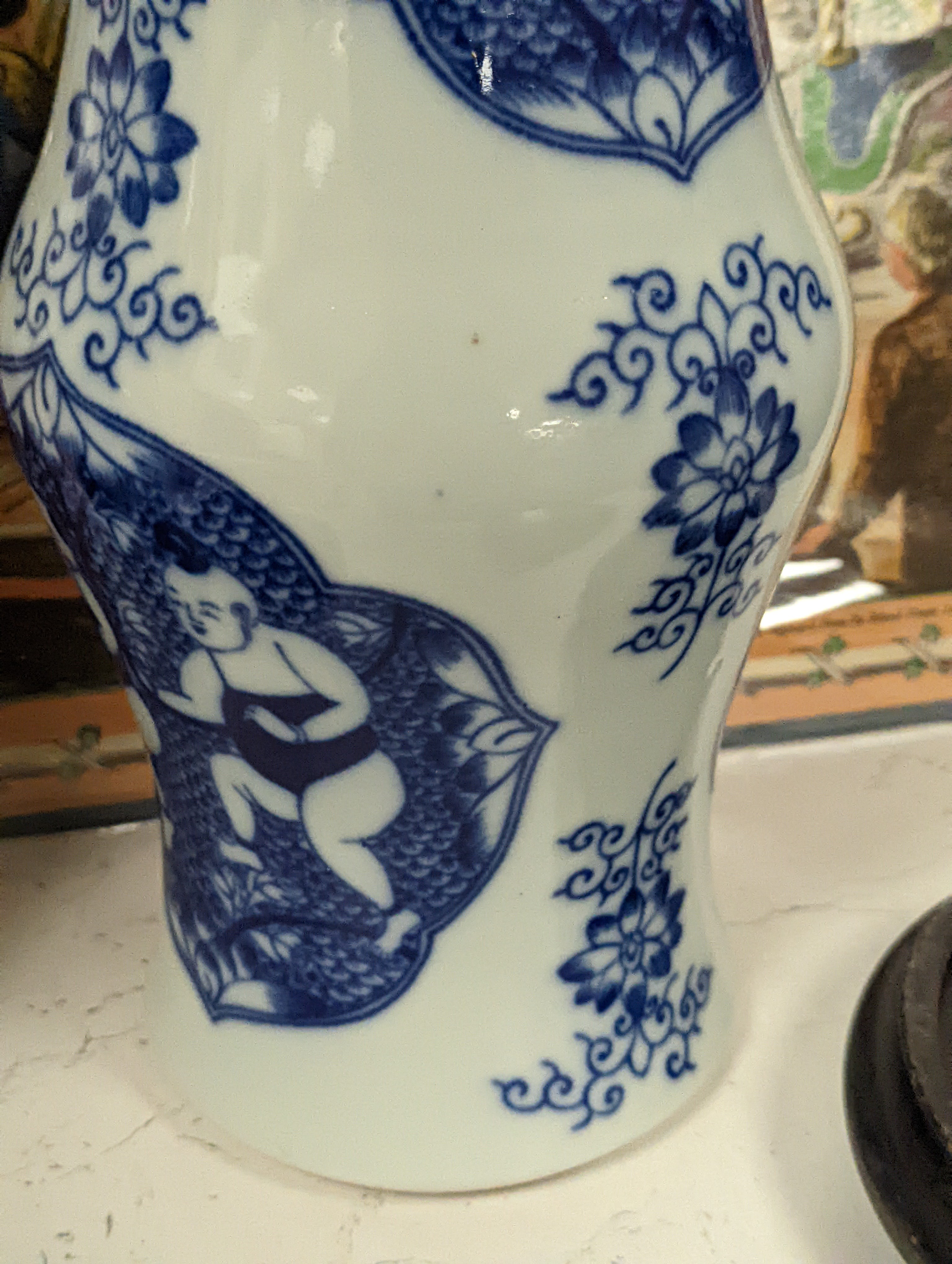 A pair of Chinese blue and white vases on stands and 6 further wood stands. Vases 35cm